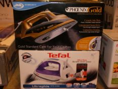 Lot to Contain 2 Boxed Assorted Steam Irons to Include a Tefal and a Pheonix RRP £50 - £60 Each