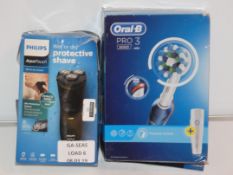 Lot to Contain 2 Assorted Items To Include an Oral B Toothbrush and a Philips Wet and Dry Triple