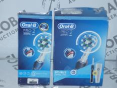 Lot to Contain 2 Boxed Oral B Pro 2 Toothbrushes RRP £40 Each (Viewing Is Highly Recommended)