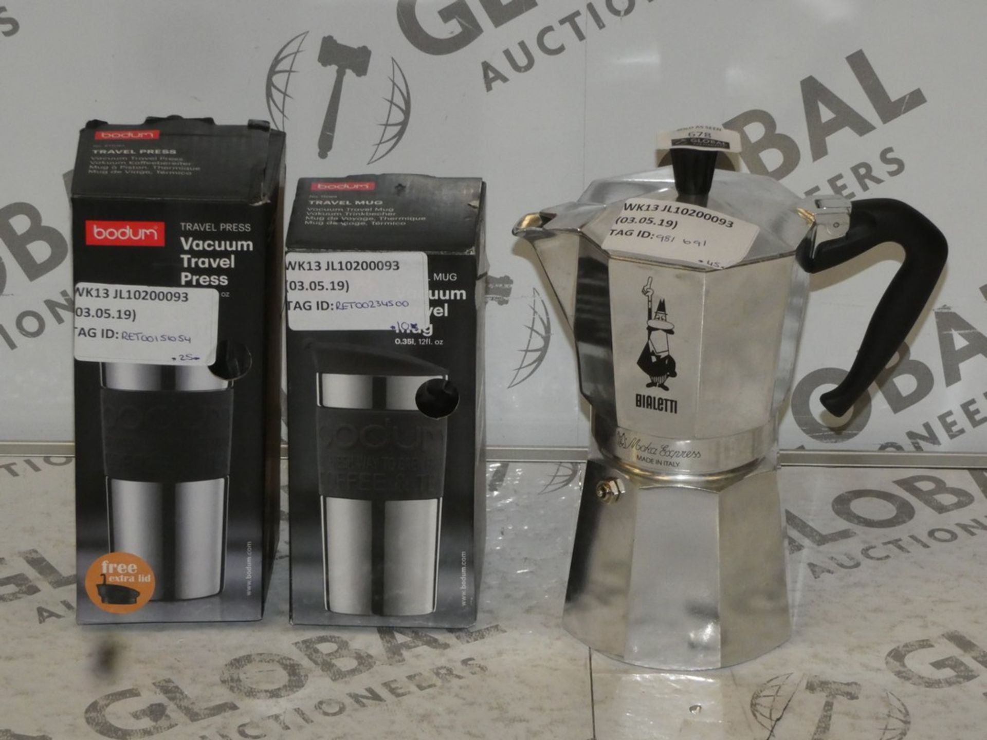 Assorted Boxed and Unboxed Items to Include a Coffee Press, Bodum Travel Mug and a Bodum Vacuum