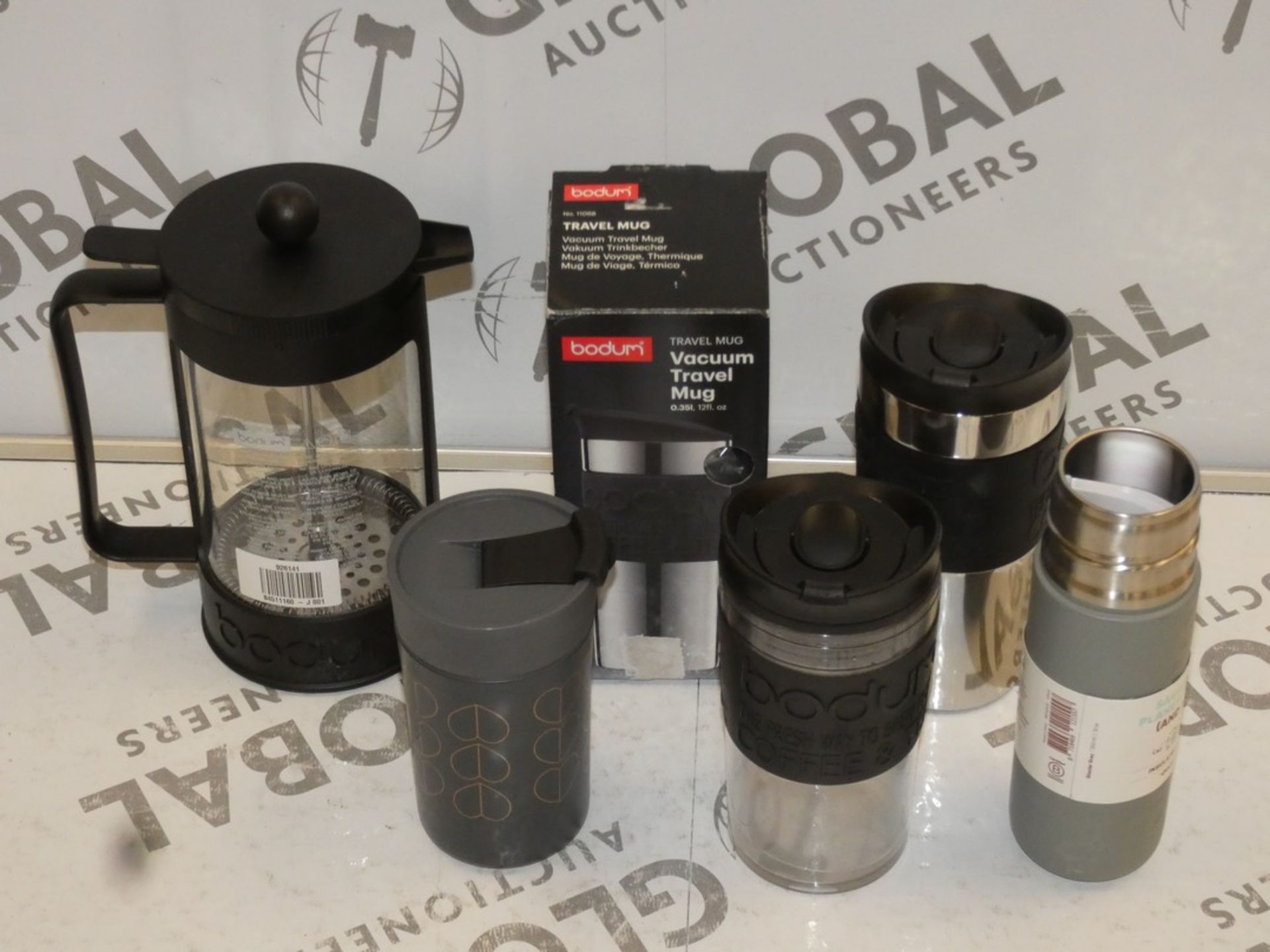 Assorted Items in a Box to Include a Bodum Coffee Press, 3 Bodum Travel Mugs, Travel Mug and a