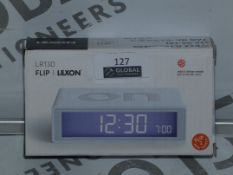 Lot to Contain 4 Boxed Lexon R130 Flip Alarm Clock