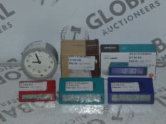 Lot to Contain 6 Assorted Boxed and Unboxed Lexon Alarm Clocks and Jones Mantle Clocks Combined