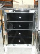 Stylish Mirrored Glass and Black Accent 4 Drawer Cabinet from Hestia. Ht 110 x W 71 x D 41 cms.