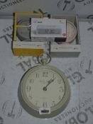 Lot to Contain 4 Assorted Boxed and Unboxed London Clock Company Wall Clocks, Lexon Flip Mini