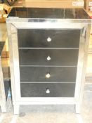 Stylish Mirrored Glass and Black Accent 4 Drawer Cabinet from Hestia. Ht 110 x W 71 x D 41 cms.