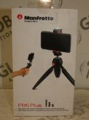 Lot to Contain 2 Boxed Manfrotto Pixi Plus Mini Tripods With A Universal Smart Phone Clamp And GoPro
