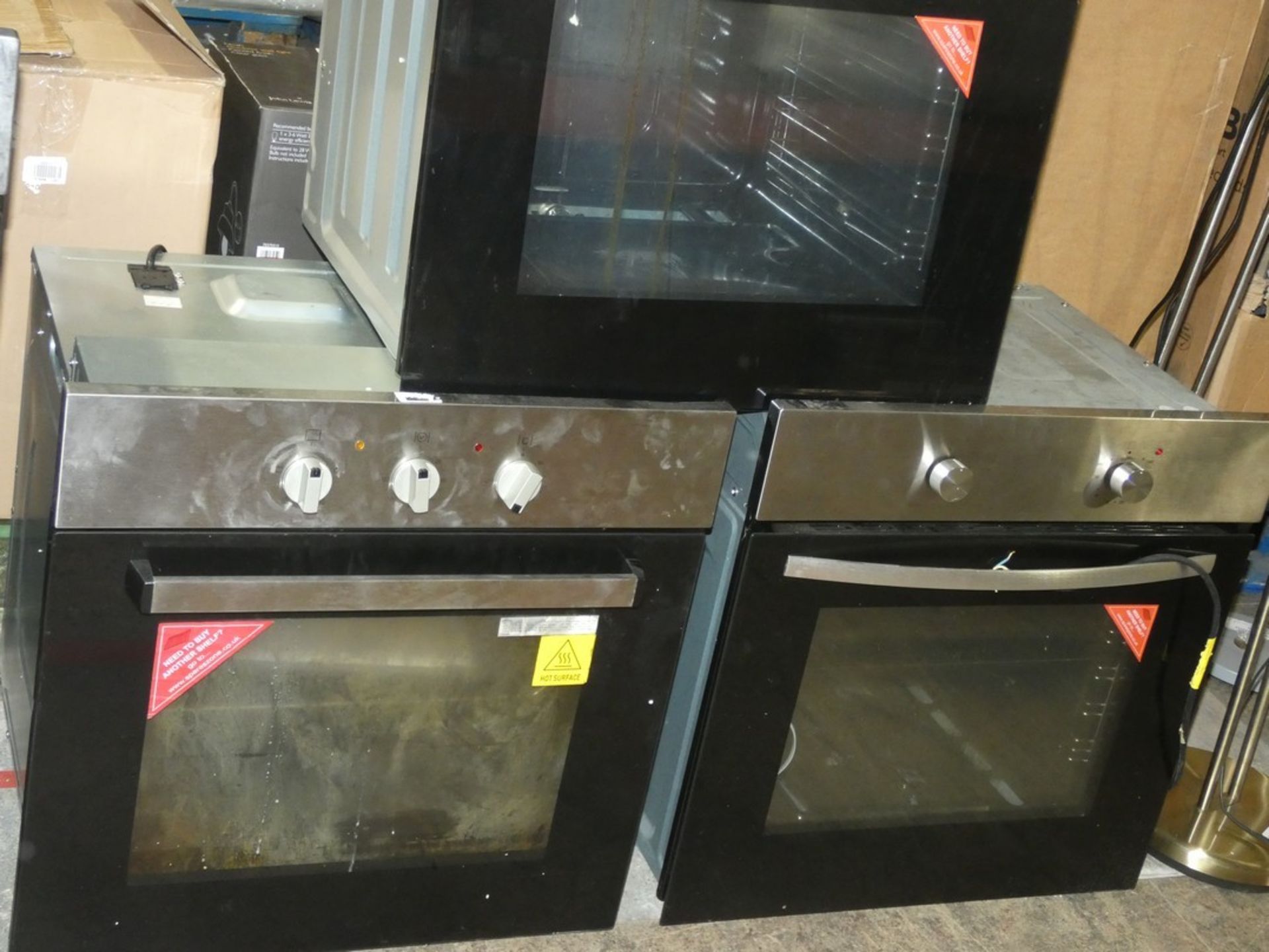 Lot to Contain 3 Stainless Steel and Black Glass Fully Integrated Gas Ovens (Viewings And Appraisals