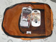 Lot to Contain 3 Assorted Items to Include Go Travel Secure Locks, Go Travel Flight Socks and Go