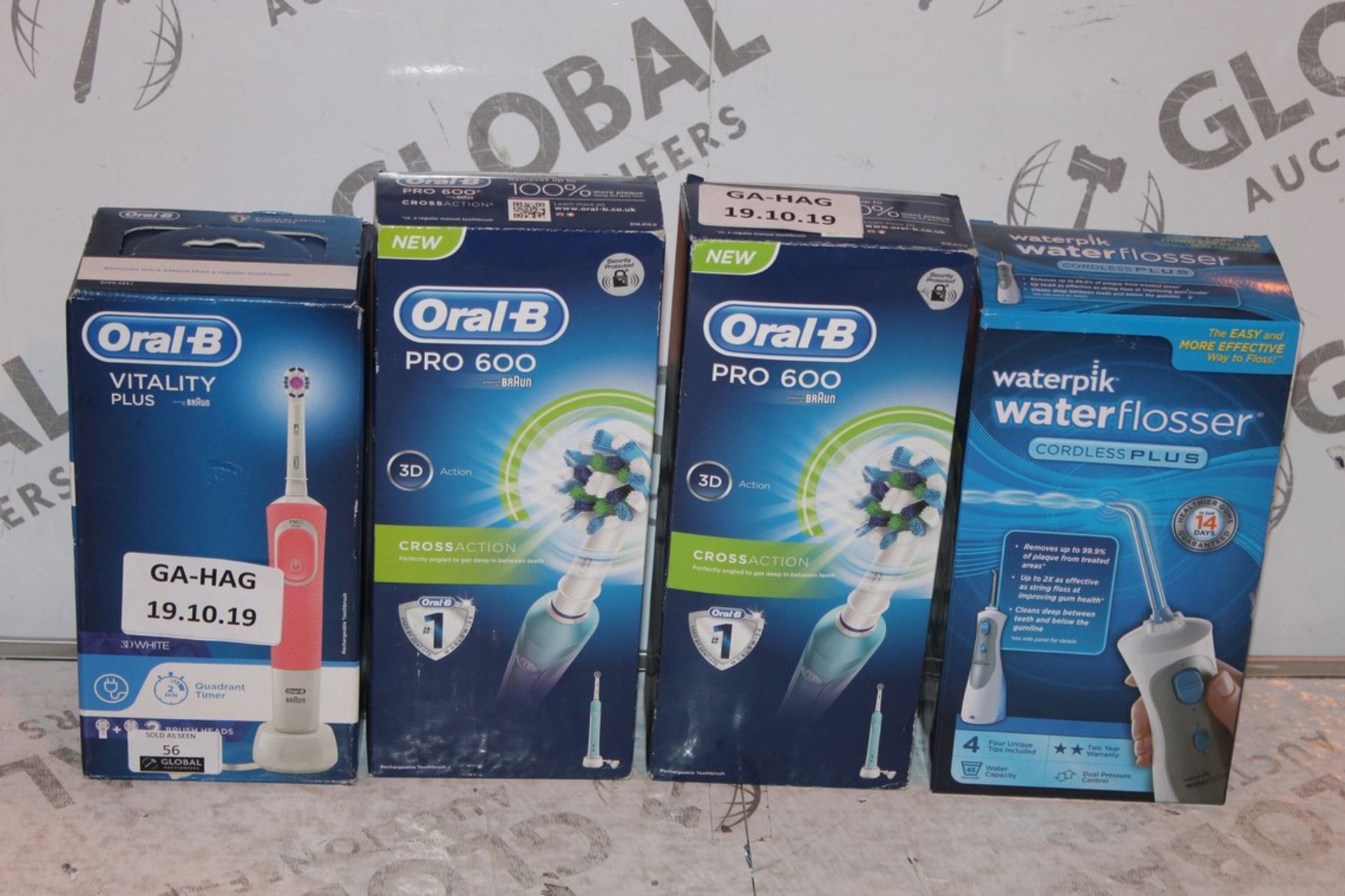 Lot to Contain 4 Assorted Items to Include an Oral B By Braun Vitality Plus Electric Toothbrush