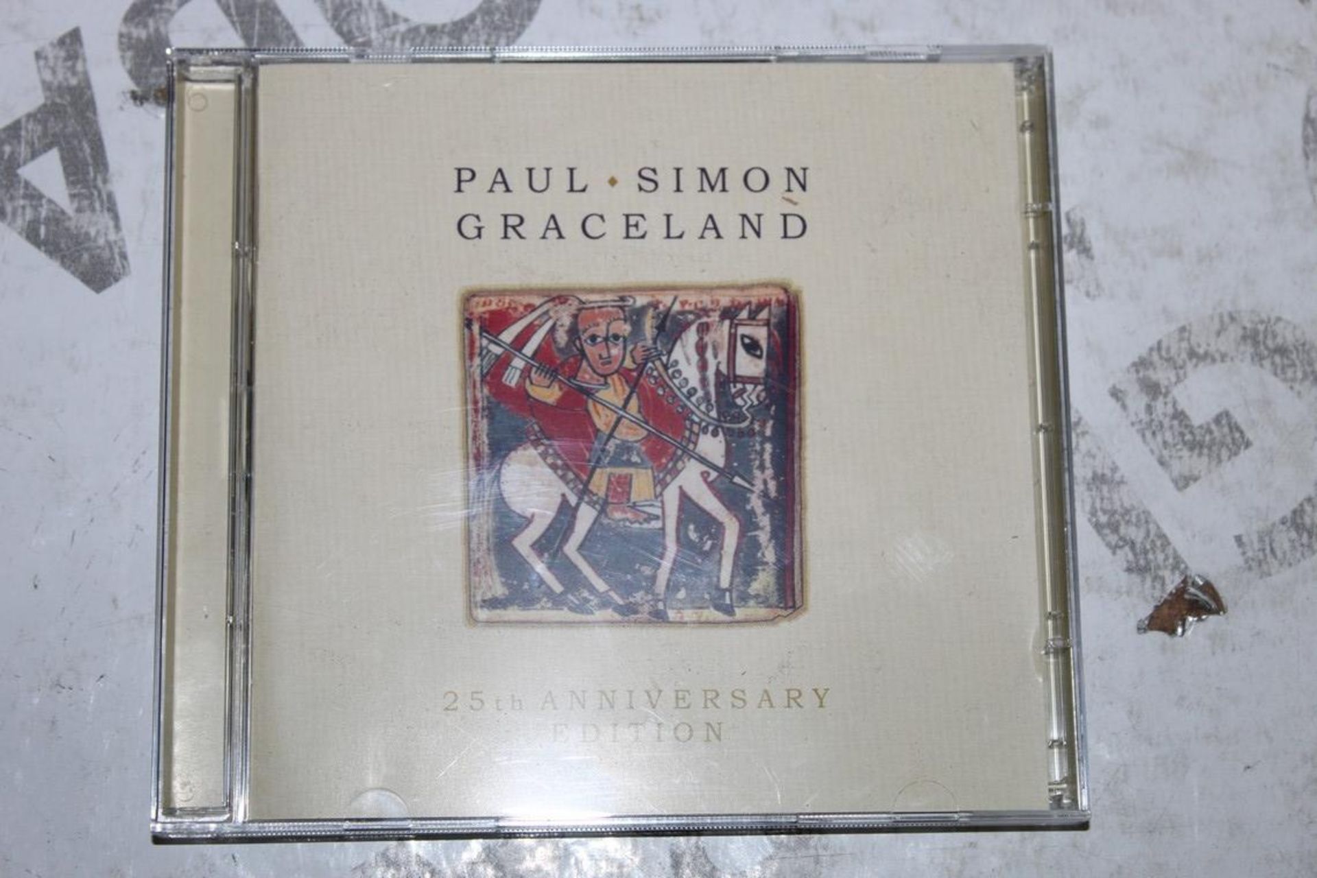 Lot to Contain 25 Brand New Paul Simon Graceland 25th Anniversary Edition (Public Viewing and