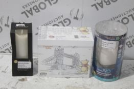 Assorted Items to Include a Lumee Blow Magic Lantern Rechargeable and a Luminara Flameless Candle