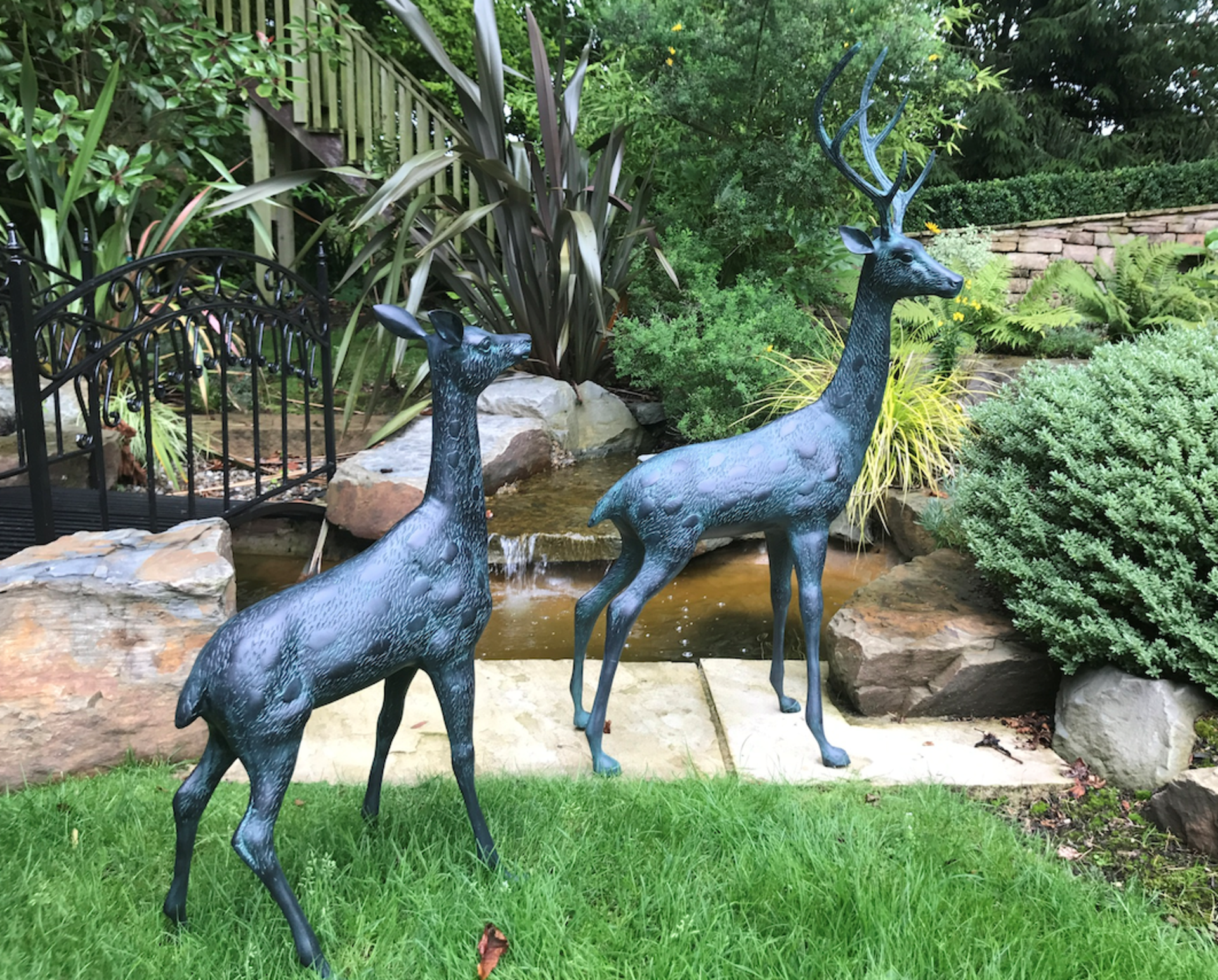 LARGE PAIR CAST METAL DEERS IN VERDI BRONZE FINISH