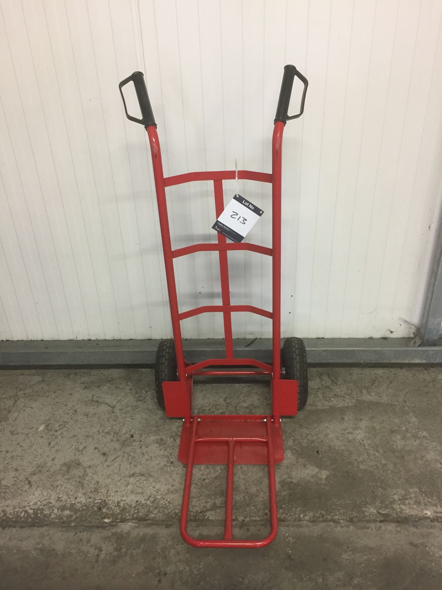 Red steel sack trucks with pneumatic wheels