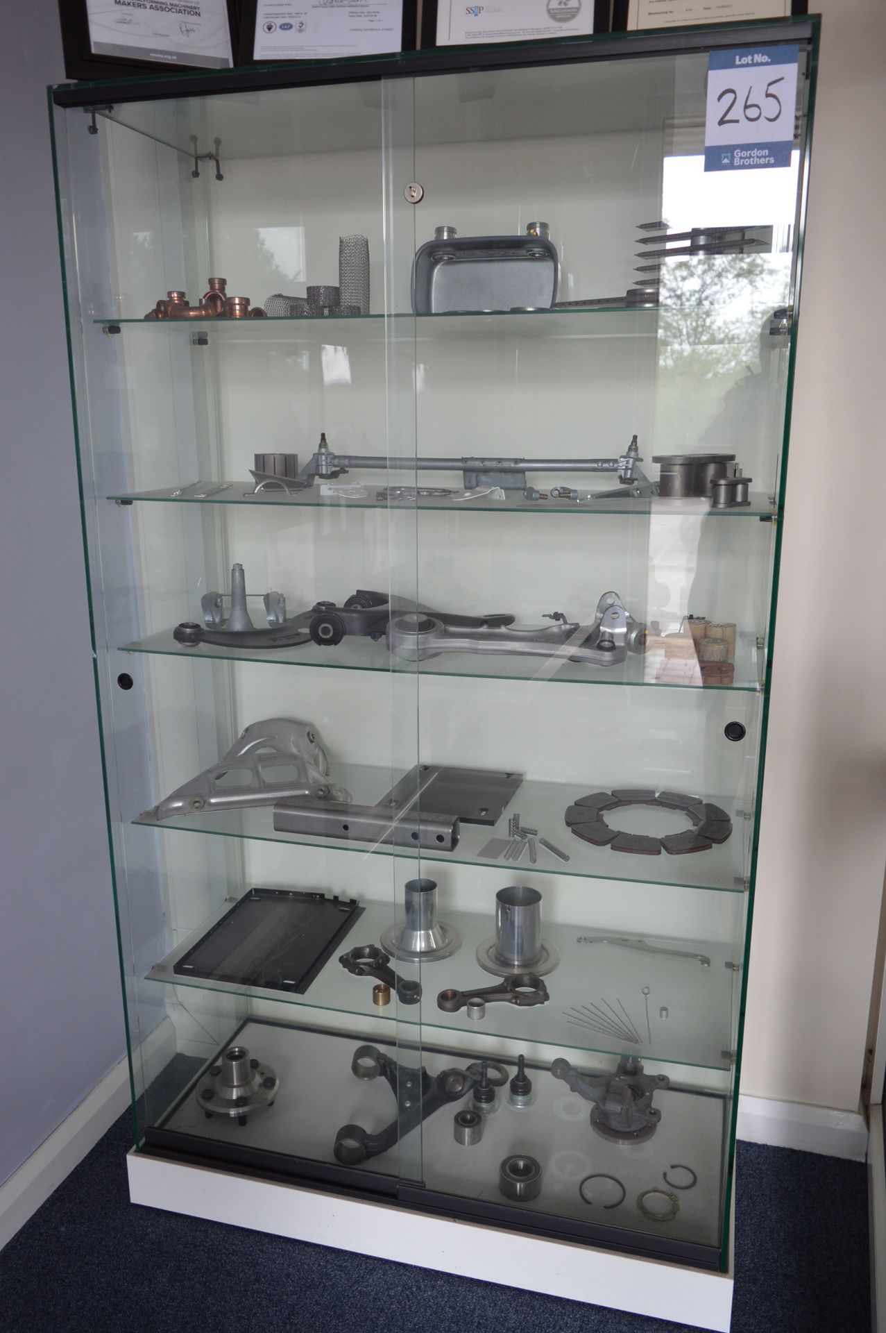 P J Hare Display cabinet and contents, as lotted