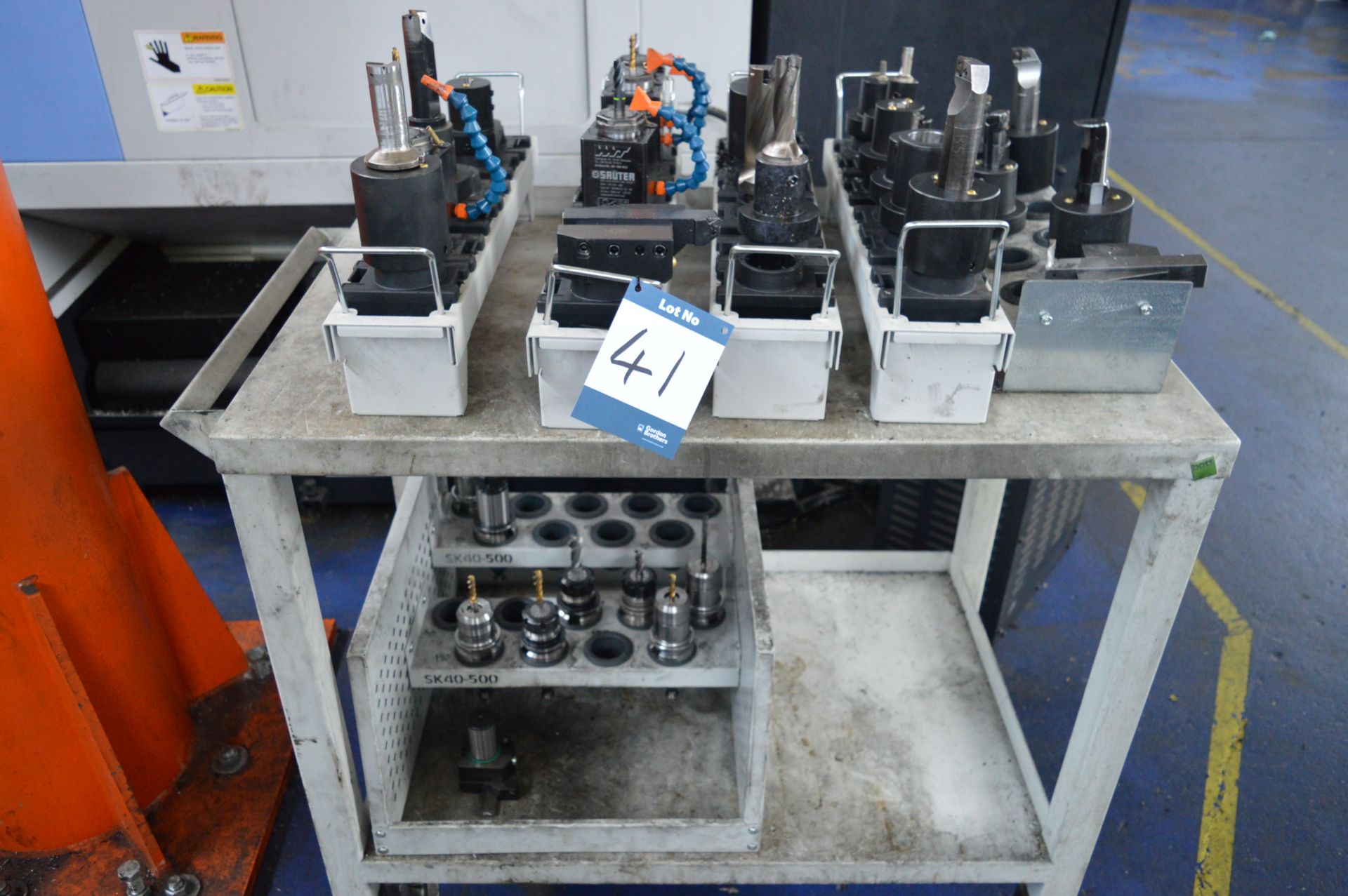 Quantity of taper shank tool holders, drills, cutters etc., with trolley, as lotted