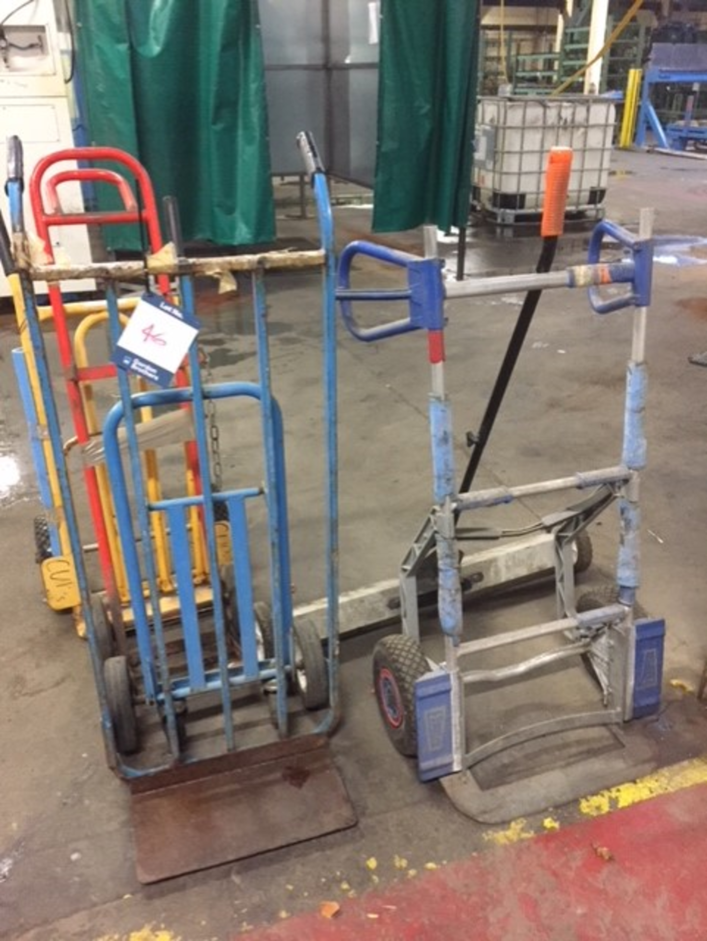Four various sack trucks and a floor scrubber**This lot is located at The Willows Site, CF48 1YH**