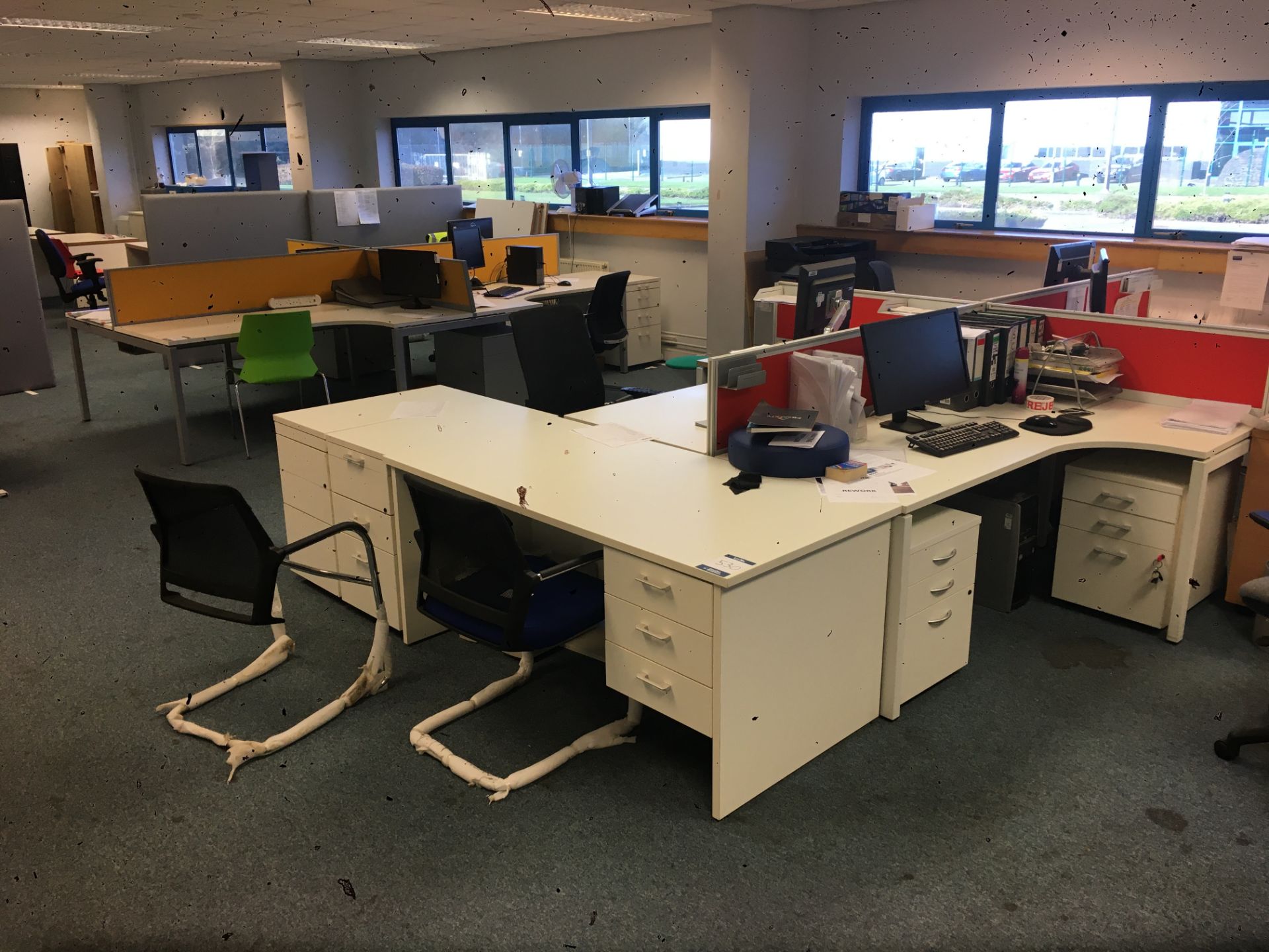 Contents of open plan office comprising; (2) four section workstations, office chairs, desk, storage