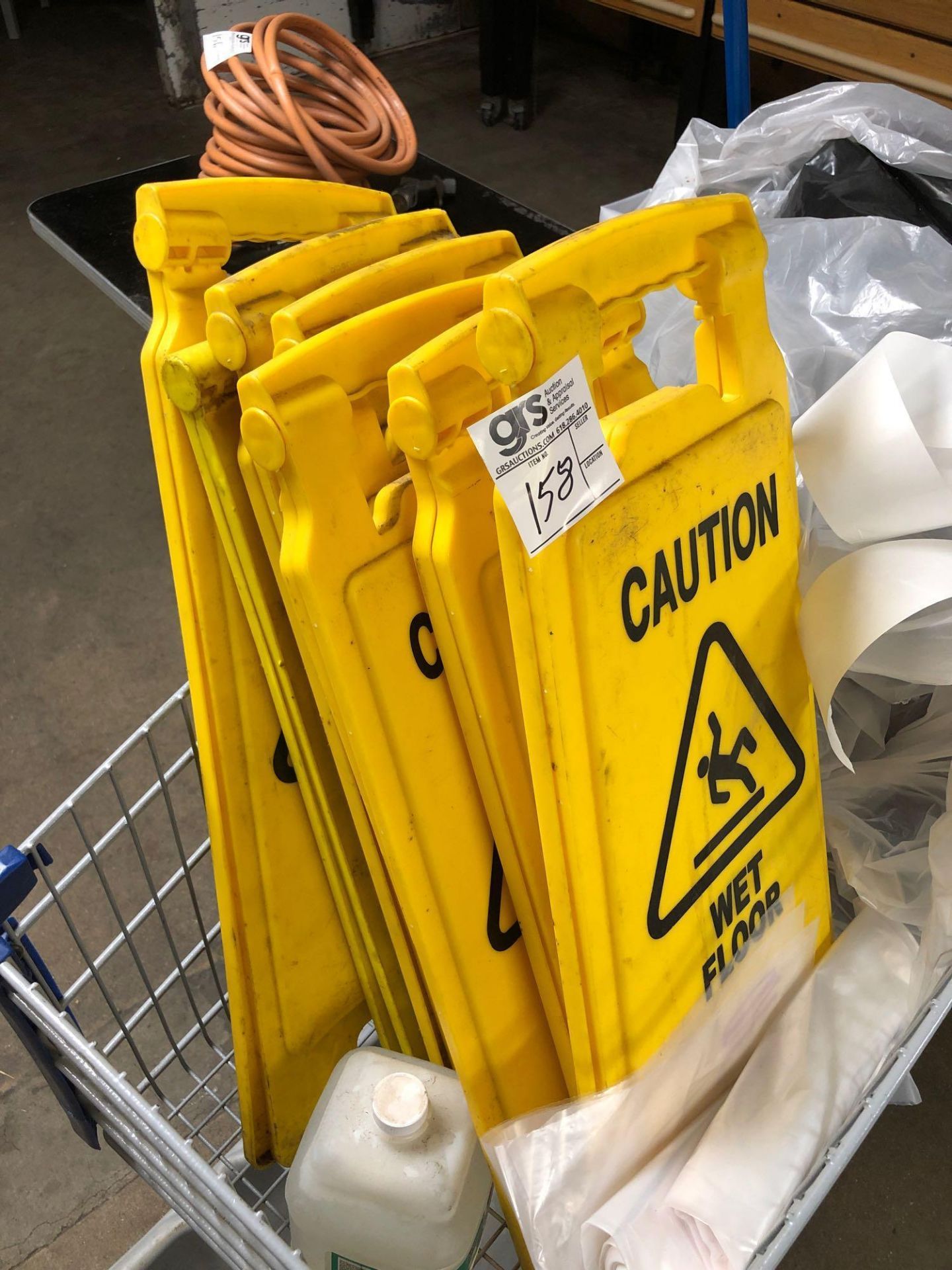 Cart Full of Wet Floor Signs