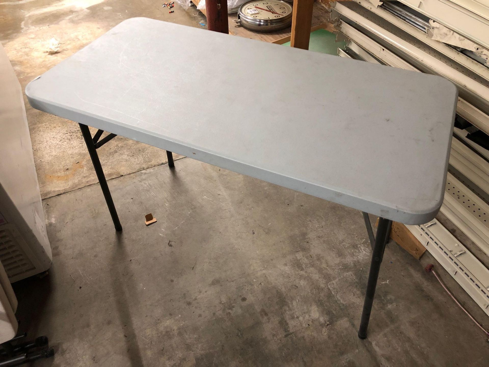 Plastic folding table