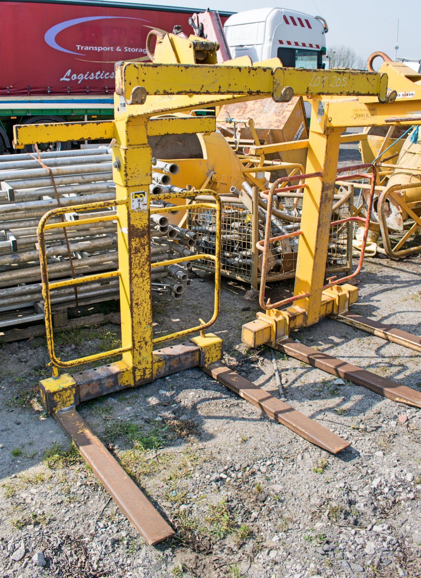 Self balancing crane fork lift attachment