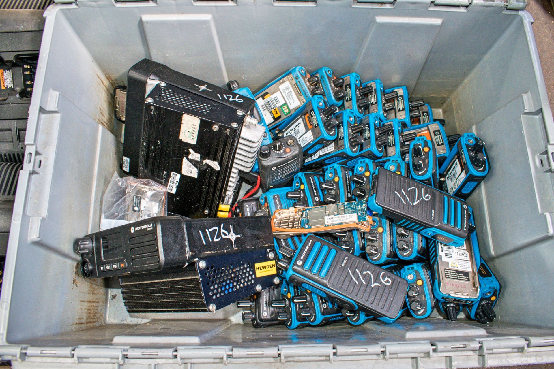 Box of miscellaneous Motorola 2 way radio sets as photographed