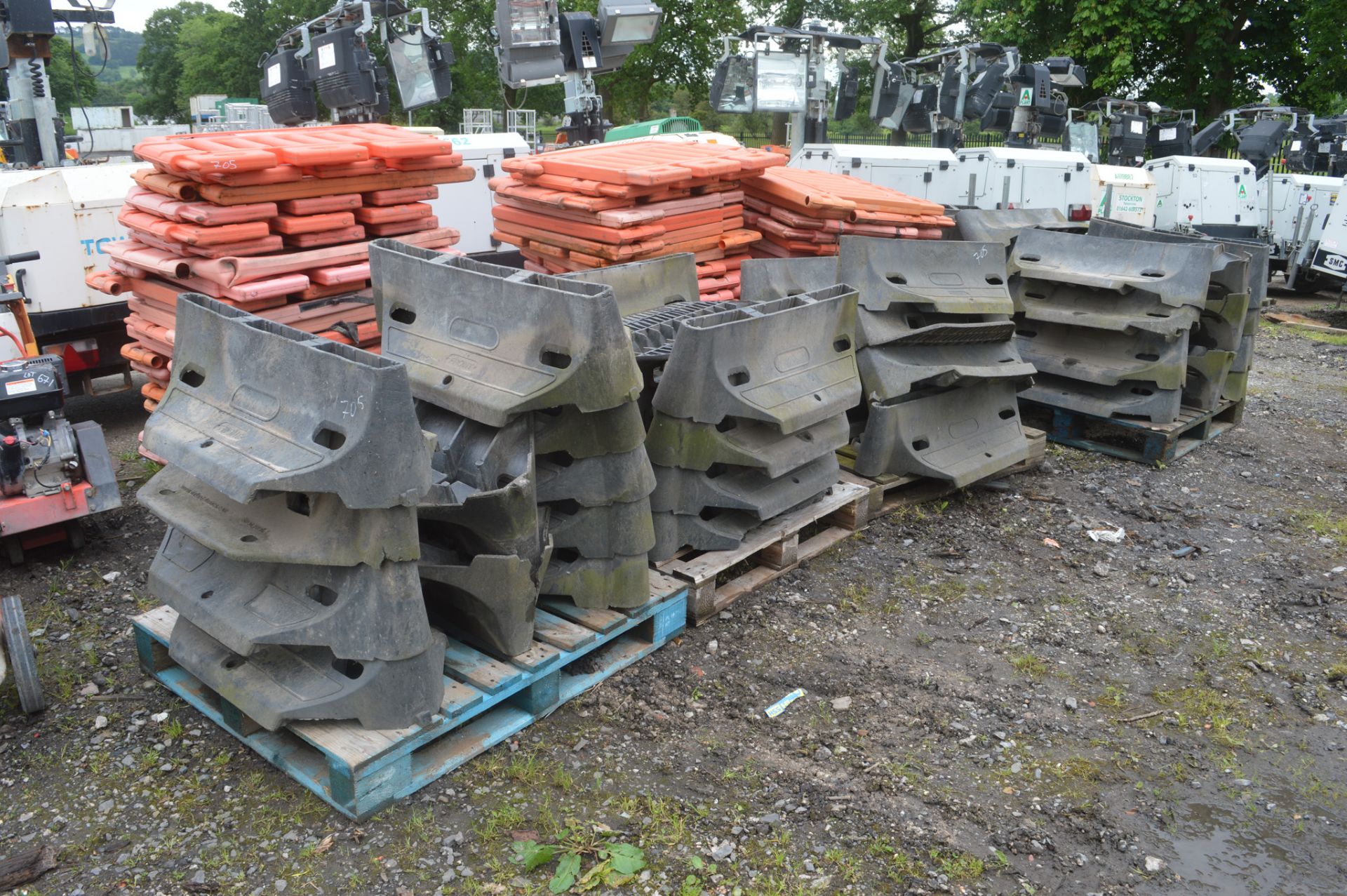 Quantity of plastic security barriers on 7 pallets as photographed