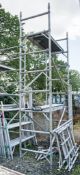 Aluminium scaffold tower comprising; 6 end frames 8 cross beams 4 wheeled feet 2 staging boards