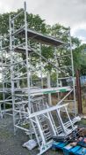 Aluminium scaffold tower comprising; 8 end frames 8 cross beams 4 wheeled feet 3 staging boards