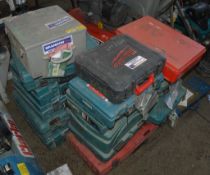 Approximately 20 empty power tool boxes