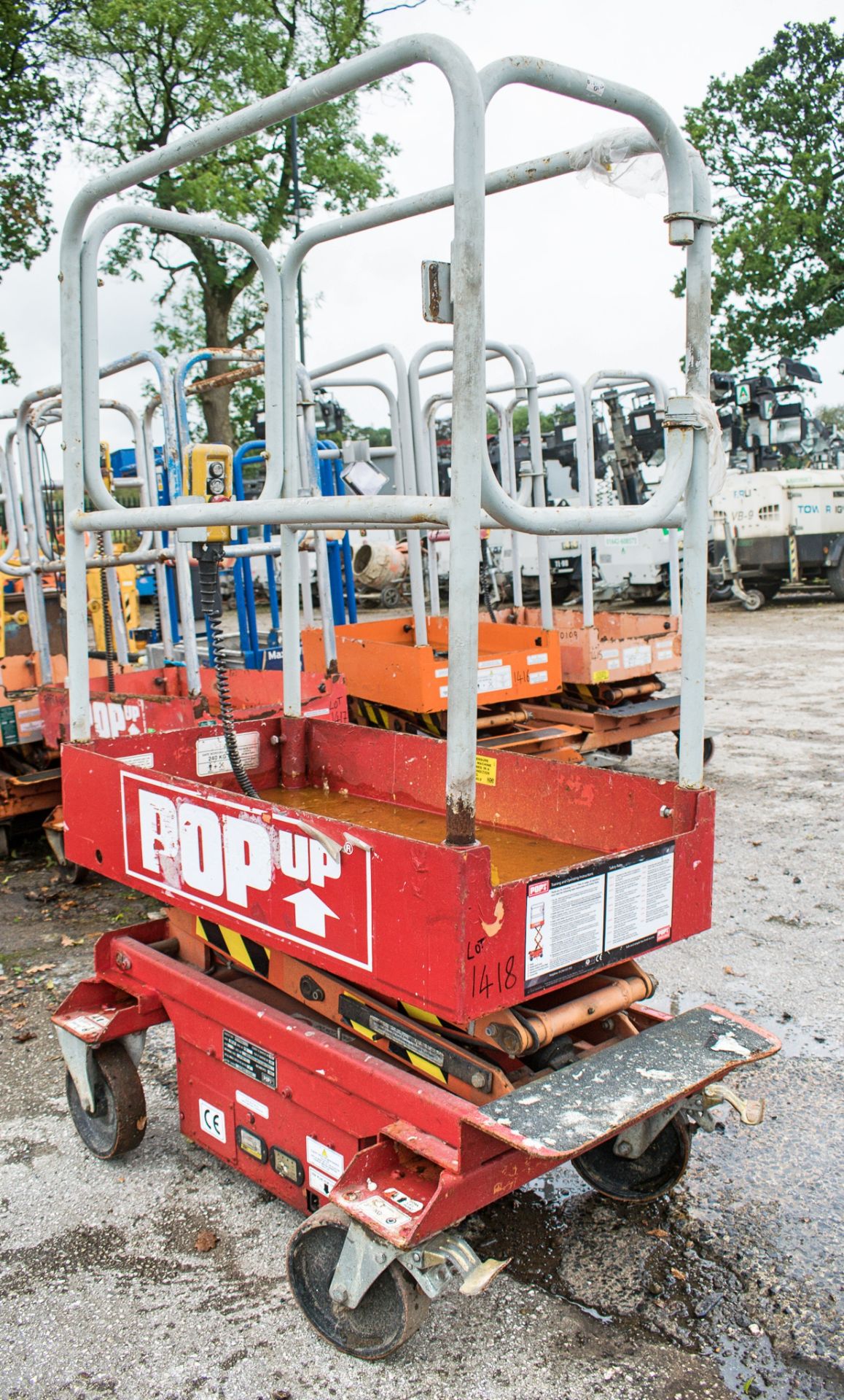 Pop-Up push around battery electric scissor lift