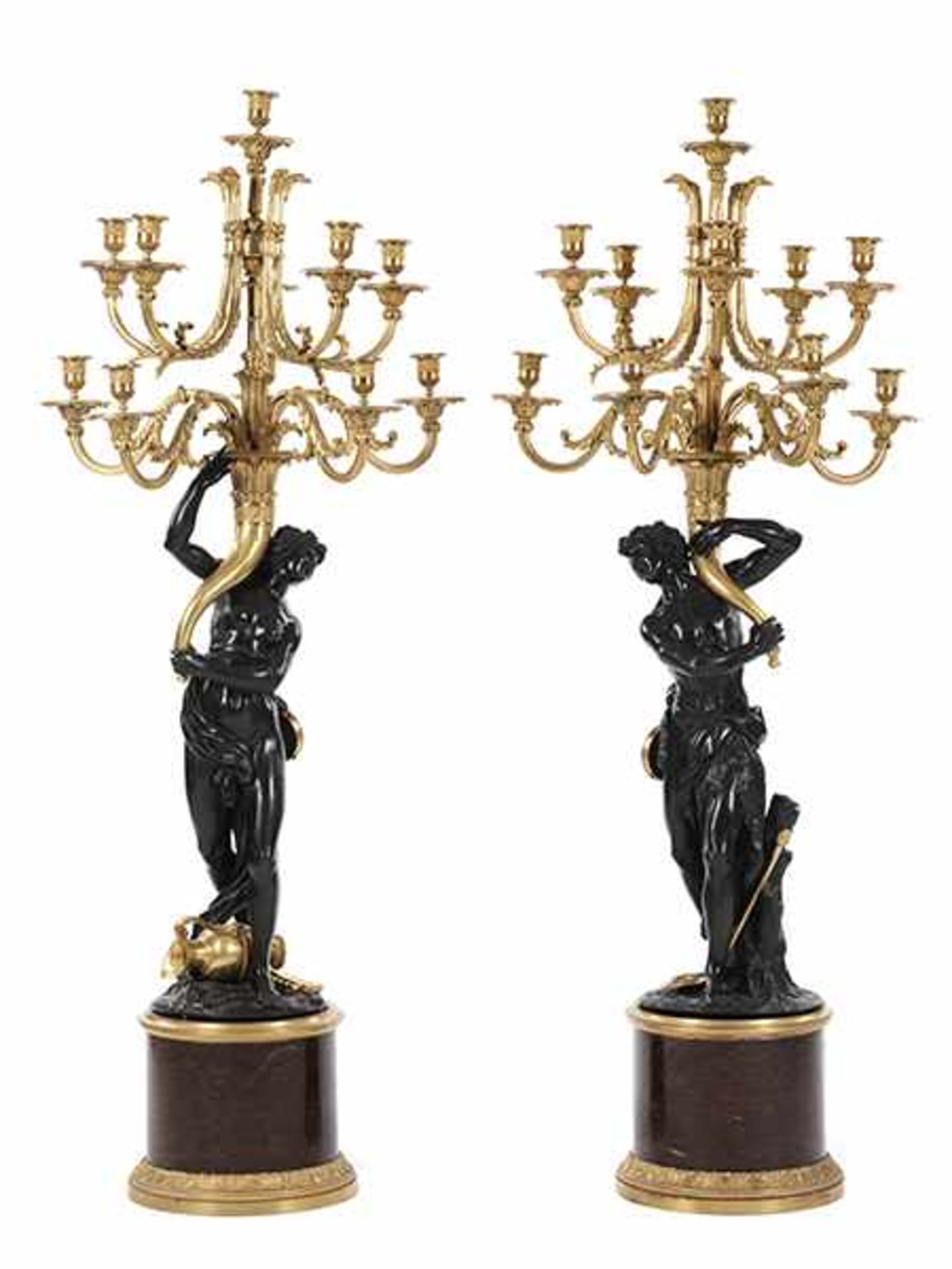 A pair of exceptional large girandoles in burnished and gilt bronze on marble bases