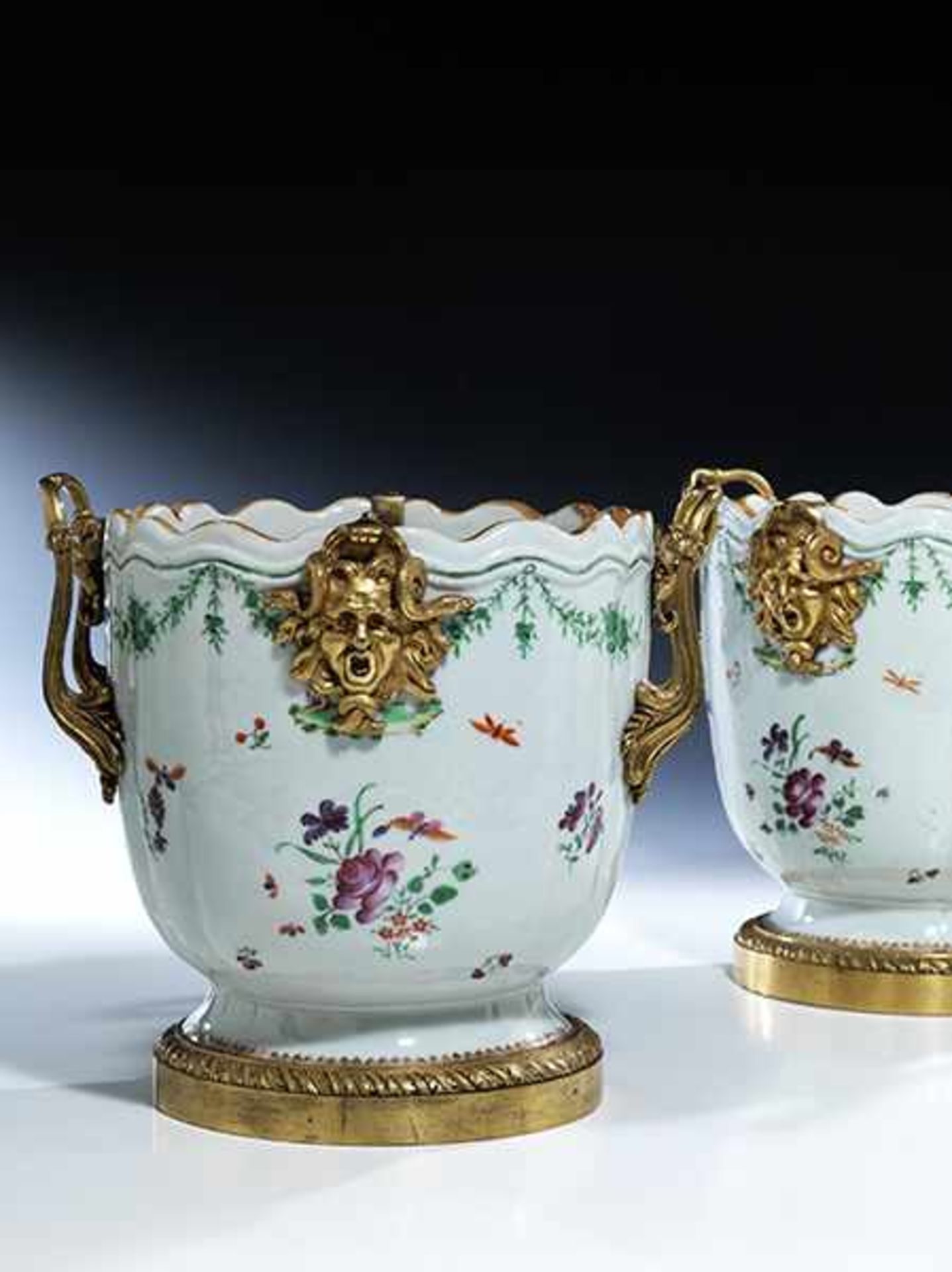 A pair of porcelain cachepots