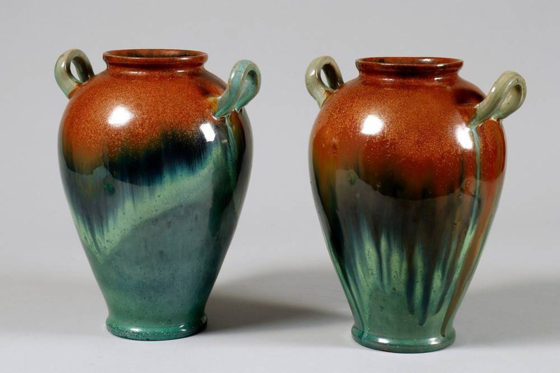 Pair of Art Nouveau vases poss. Belgium, ca. 1900, ovoid body, brown/green glaze, 2 small handles,