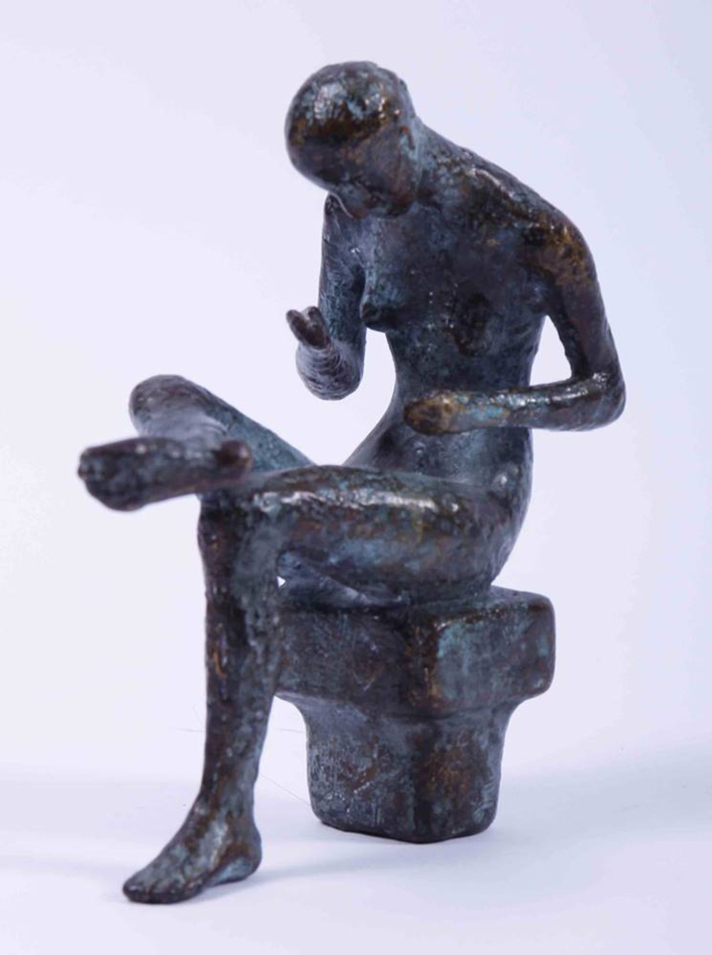 Wolfgang FriedrichSmall, seated woman, bronze, partially patinated, signed and dated (19)92 verso,