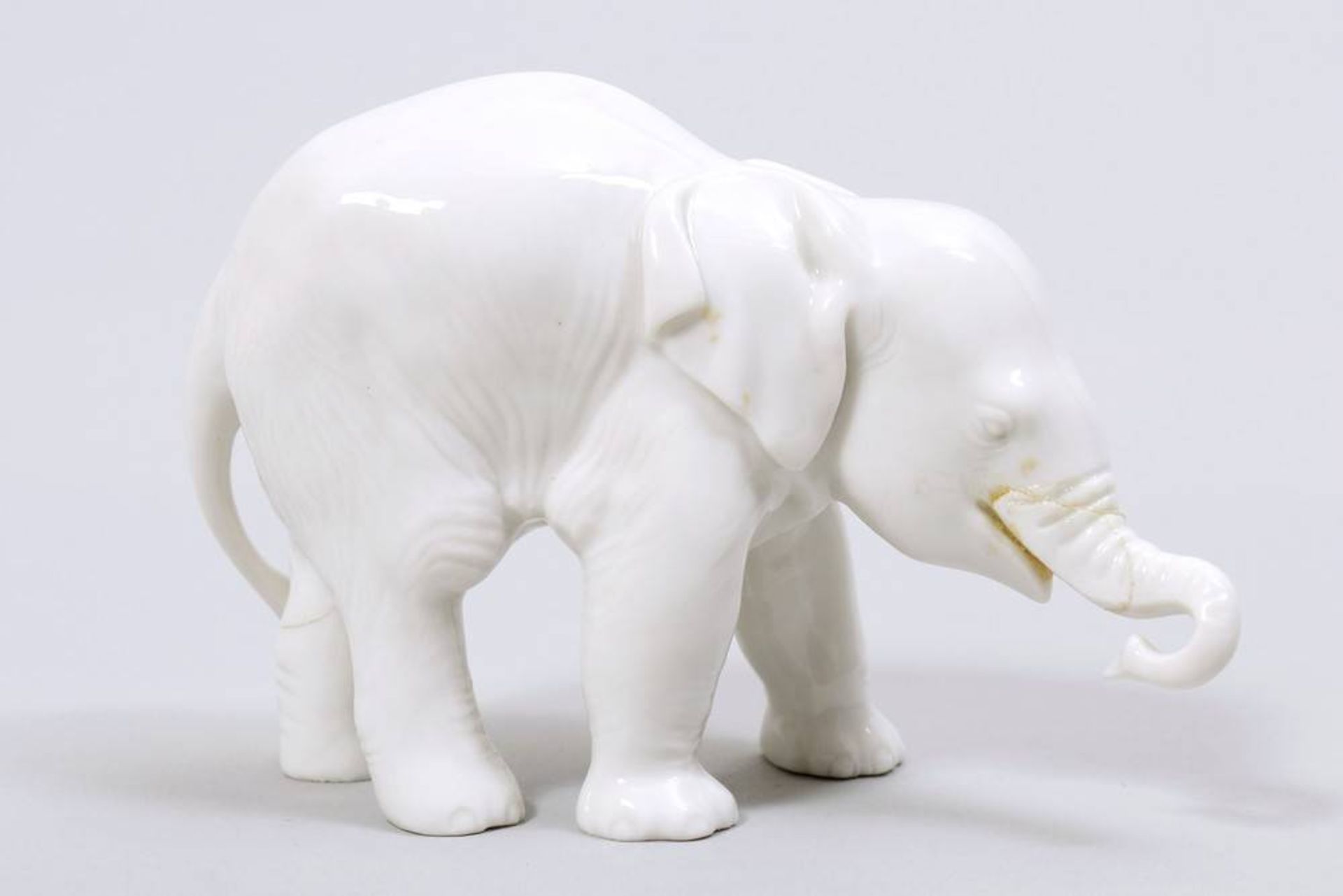 Standing elephant Allach, 1933-45, porcelain, marked, No. "3", H: 7cm, trunk and 1 leg glued/