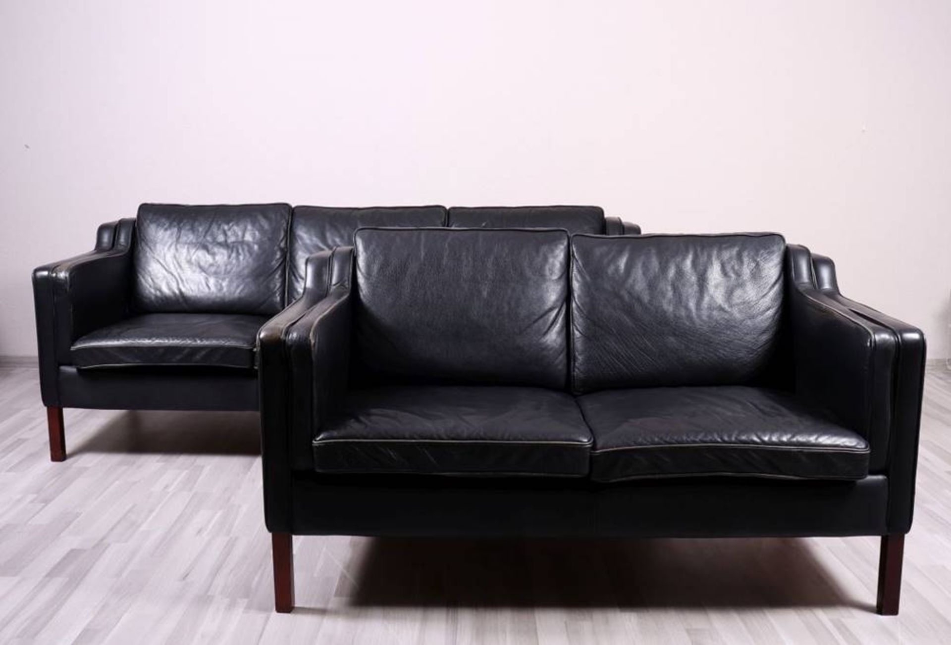 Sofa setStouby, Denmark, 20th C., model "Eva", 2 seater and 3 seater sofa, black leather upholstery,