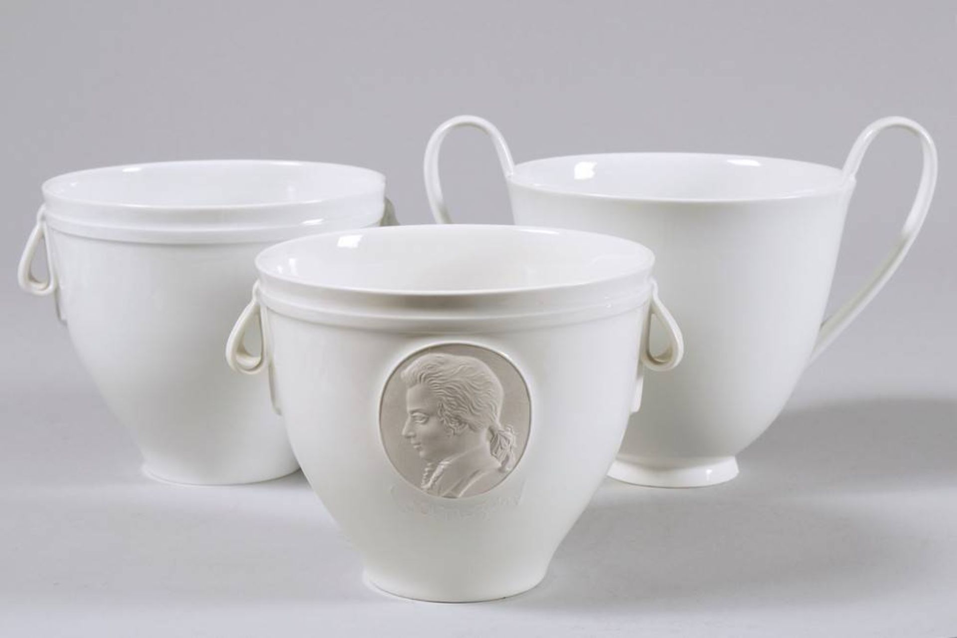 3 cachepots, KPM-Berlin 20th C., design Siegmund Schütz, 1935, 2 showing portraits of Hölderlin