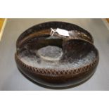 Tribal Art, a coco de mer in the form of a hand basket, with double internal division,