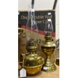 Two late 19th Century brass oil lamps, with glass funnels,