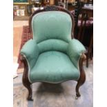 An early Victorian rosewood Gentleman's tub chair, upholstered,