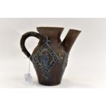 Ecclesiastical jug with applied detail, portrait of Monarch,