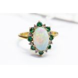 An 18ct gold, opal, emerald and diamond cluster ring, size M, total gross weight approx 4.