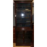 A late Victorian two-tier glazed bookcase,