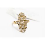 A Victorian/ Edwardian diamond marquise shaped cluster ring, with diamond set shoulders,