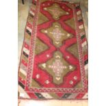 Large red and fawn rug with geometric design