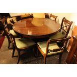 An early Victorian rosewood tilt top pedestal breakfast table, standing on a triform base,