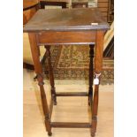 An Arts and Crafts oak square occasional table