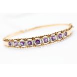 An amethyst, diamond and 9ct gold bangle,