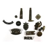 A collection of various WWI military shoulder badges, bullets and balls, brass bullet shells,